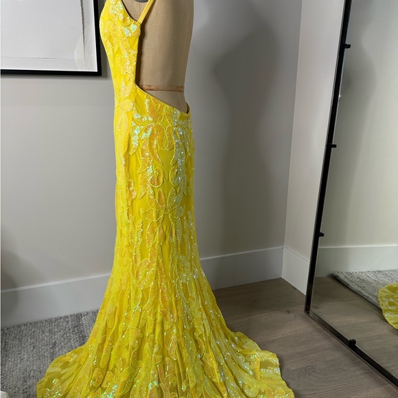 JoVani Yellow Dress
The Jovani 07784A Yellow Pattern Sequin Embellished Gown - Picture 4 of 7